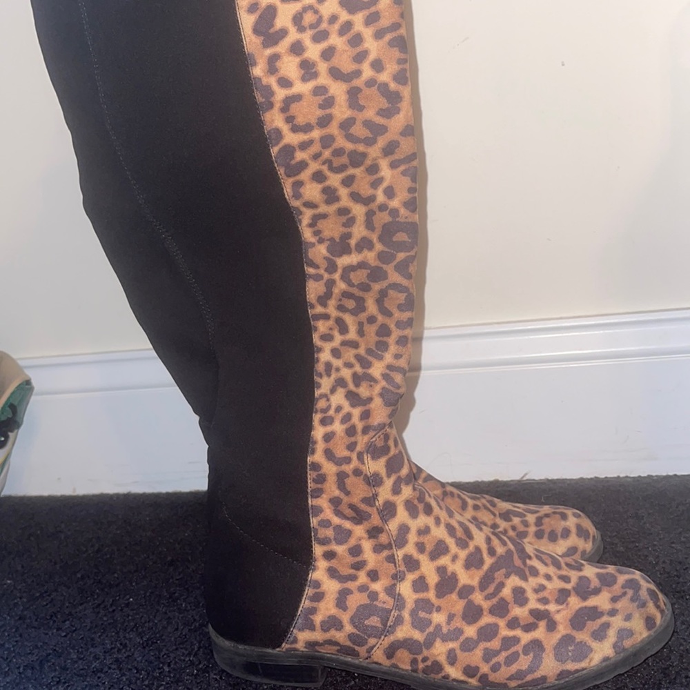 Over the knee boot with stretch material on backing for easier slide on